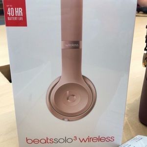 Wireless rose gold beats headphones